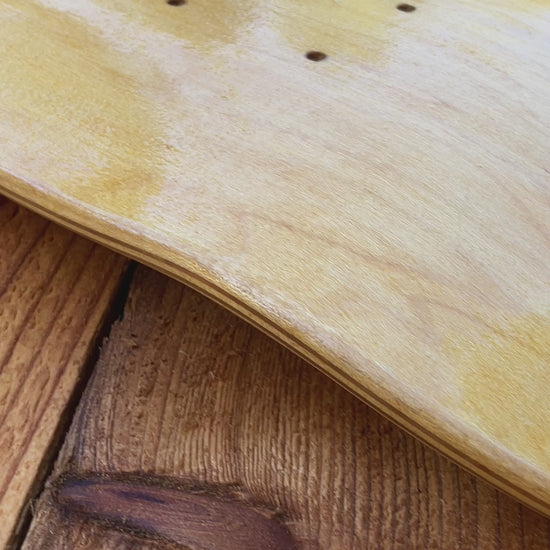 Applying tung oil to skate deck as canvas