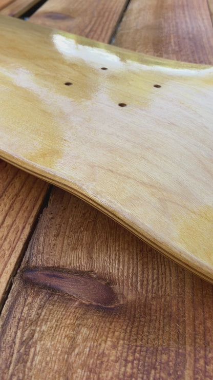 Applying tung oil to skate deck as canvas